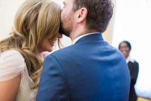 Islington town hall wedding ceremony groom kissing bride